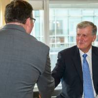 President Haas shakes hands with speaker